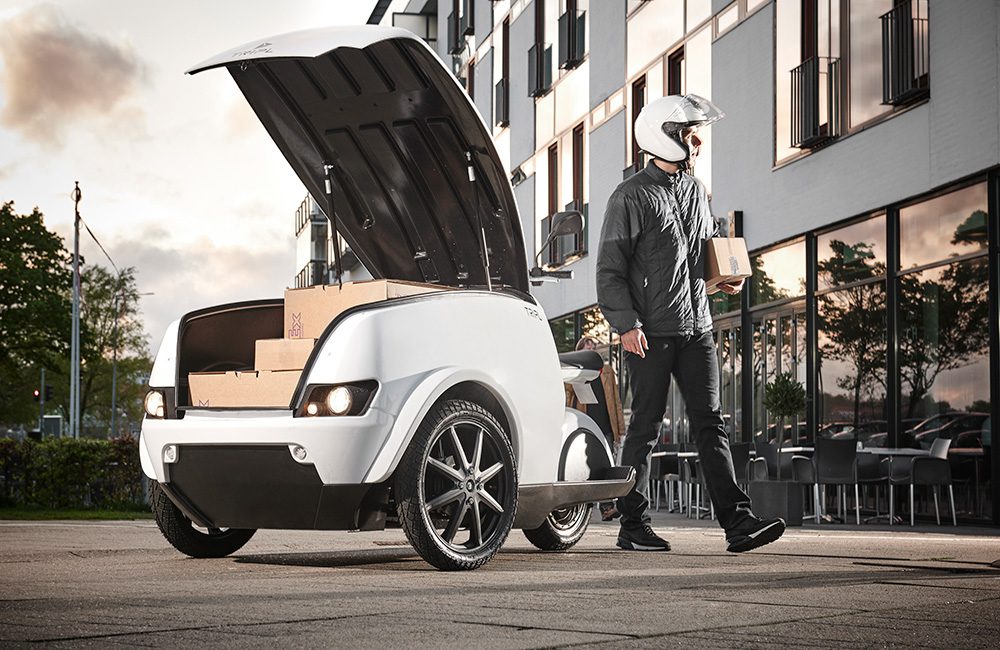 Delivery employee working with Trip Electric scooter