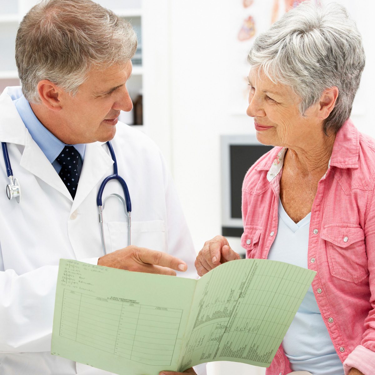 A doctor talking to an old lady at the hospital 1