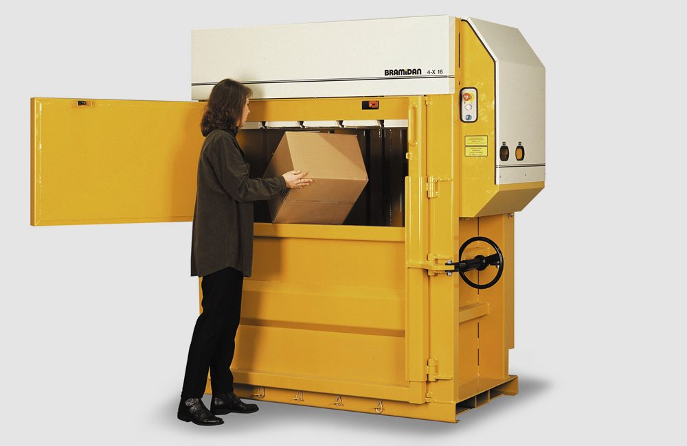 a woman putting paper box in Bramidan presser