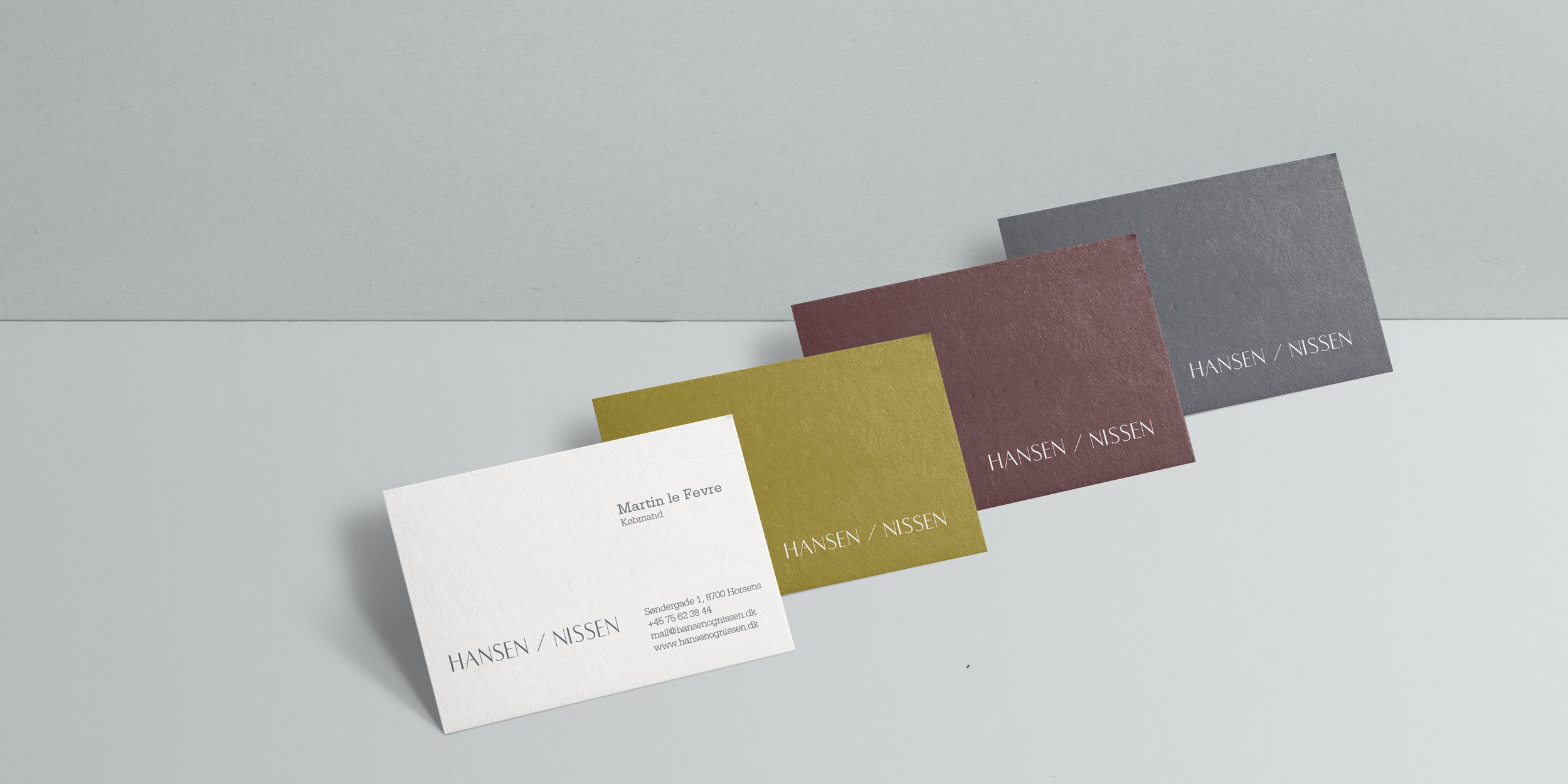 Hansen / Nissen 4 business cards - white, yellow, dark red, gray